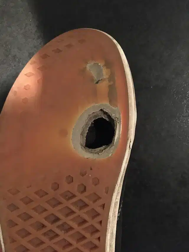 A view of a shoe sole with a hold inside