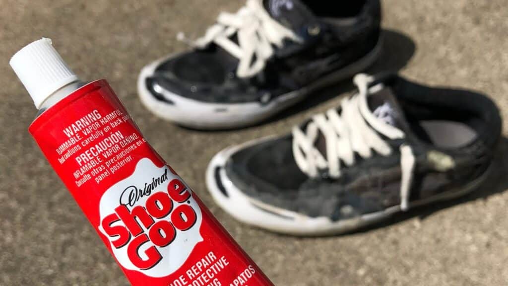 Shoe Goo glue and pair of shoe 