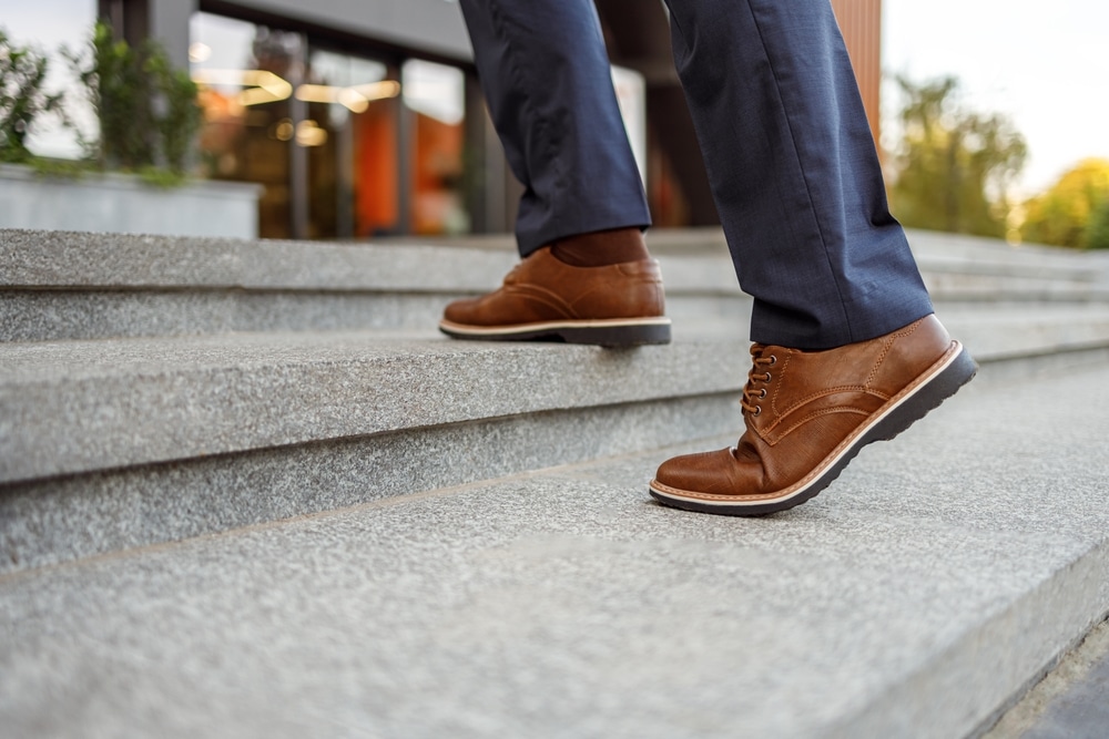 Low Section Of Senior Male Entrepreneur In Brown Leather Shoes